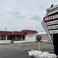 Grandview Restaurant sign and building at 2221 Grand Ave. in Galesburg after announcing permanent closure in December 2025. Snow on the ground^ empty parking lot.