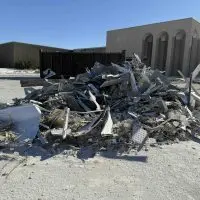 Large pile of construction debris outside the former Sears building at Sandburg Mall in Galesburg