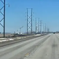 Utility crews and transmission towers under construction along U.S. Highway 34 in Knox County