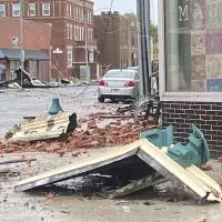 Brick and building debris scattered across a downtown Monmouth street after the June 17 tornado