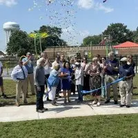 A crowd gathers as confetti falls during the Cooke Park ribbon-cutting ceremony in Galesburg