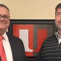 Tom Hawkins^ left^ shakes hands with United CUSD 304 Board President Hank Shimmin following Hawkins approval on Thursday evening as the next Superintendent for the United School District.