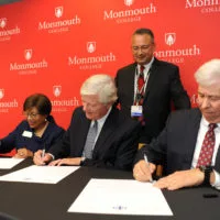OSF HealthCare and Monmouth College have established the Monmouth College - OSF 3+1 nursing program. Signing the agreement at a ceremony Thursday at Monmouth College were^ from left: Dr. Charlene Aaron^ President^ OSF Colleges of Nursing; Monmouth College President Clarence Wyatt; and Robert Sehring^ CEO^ OSF HealthCare. In the back is Dr. Ralph Velezquez^ System Chief Medical Officer^ OSF HealthCare and a member of the Monmouth College Board.