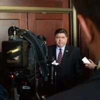 Gov. JB Pritzker speaks to reporters following an event at the Illinois State Library in Springfield on Wednesday^ May 28^ 2025. Pritzker pledged to veto any budget with “broad-based” tax increases. (Capitol News Illinois photo by Jerry Nowicki)