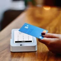 A state law banning “swipe fees” on the tax and tip portion of debit and credit card transactions could be delayed until next year. (Nathana Rebouças via Unsplash)