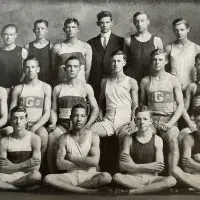 Black-and-white team photo of the 1911–12 Galesburg High School track team; freshman Adolph “Ziggy” Hamblin is seated front row^ second from the left.