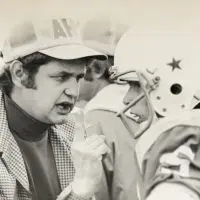 David “D-Dub” Whiteman on the sideline holding a football helmet while coaching at Abingdon High School