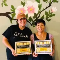 Amber Jordan and Ok Hyon (Kim) Curtis^ co-owners of Koreana Restaurant in Galesburg^ holding Taste of Galesburg awards.