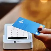 A state law banning “swipe fees” was upheld by a judge^ although opponents say they will appeal. (Nathana Rebouças via Unsplash)