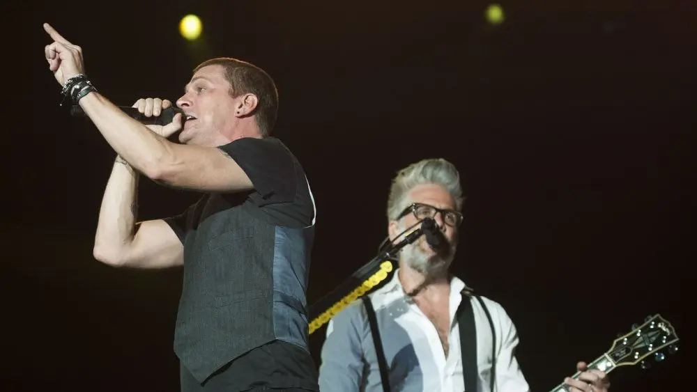 Matchbox 20 band vocalist Rob Thomas (L) performs during the Rock in Rio concert^ on September 20^ 2013 in Rio de Janeiro^ Brazil.