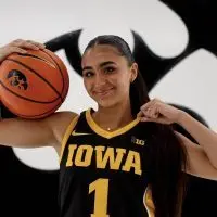 Bria Medina in an Iowa Hawkeyes jersey holding a basketball during her official visit — May 2026