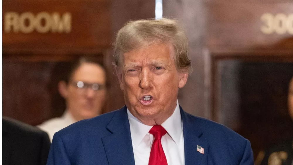 Former President Donald Trump speaks to the press before closing arguments at his civil fraud trial at State Supreme Court in New York on January 11^ 2024