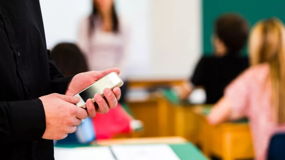 student-with-cellphone-generic