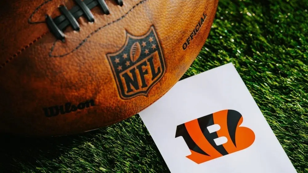 Cincinnati Bengals NFL team Logo and American football ball on Green Grass. CINCINNATI^ USA^ FEBRUARY 10^ 2025