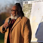 Carl Sandburg College Director of Diversity and Inclusion Anthony Law addresses the crowd at a plaque dedication ceremony  marking the location of four Railroad Camps on Monday, Oct. 30, 2023, in Galesburg. (BILL GAITHER/CARL SANDBURG COLLEGE)