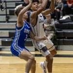 streaks-vs-quincy-bbb-01: Galesburg High School senior Gino Williams drives to the basket during the Silver Streaks' 86-34 WB6 Conference loss to Quincy on Tuesday, Dec. 5, 2023 at John Thiel Gymnasium. (Steve Davis)