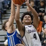 streaks-vs-quincy-bbb-02: Galesburg High School senior Gino Williams drives to the basket during the Silver Streaks' 86-34 WB6 Conference loss to Quincy on Tuesday, Dec. 5, 2023 at John Thiel Gymnasium. (Steve Davis)