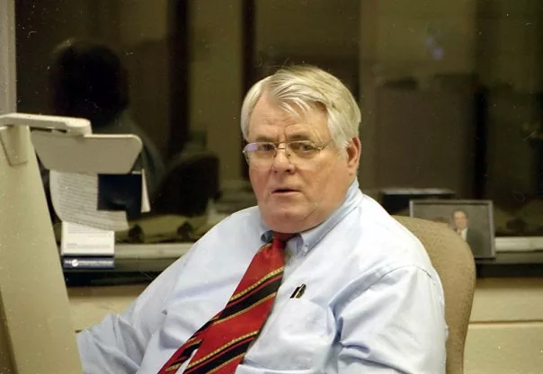 Former longtime Register-Mail editor Bob Harrison works in the newsroom office