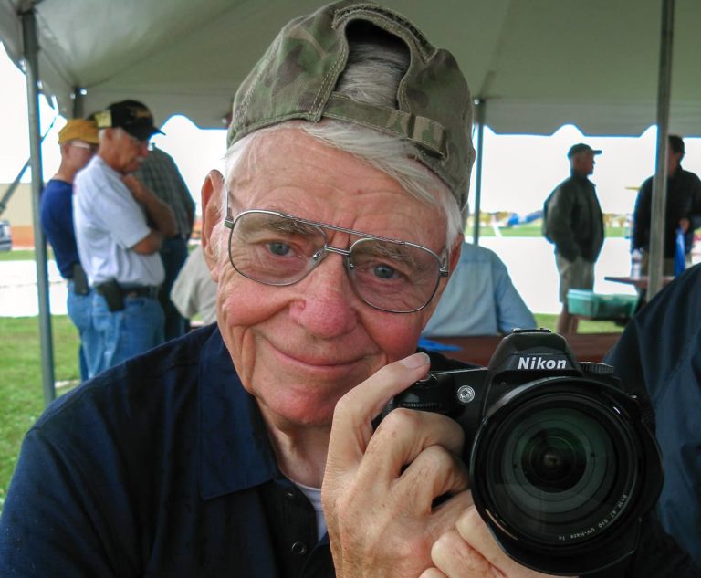 Former Register-Mail Editor and longtime board member of the National Stearman Fly-in poses for a photo at the 2015 Stearman Fly-in