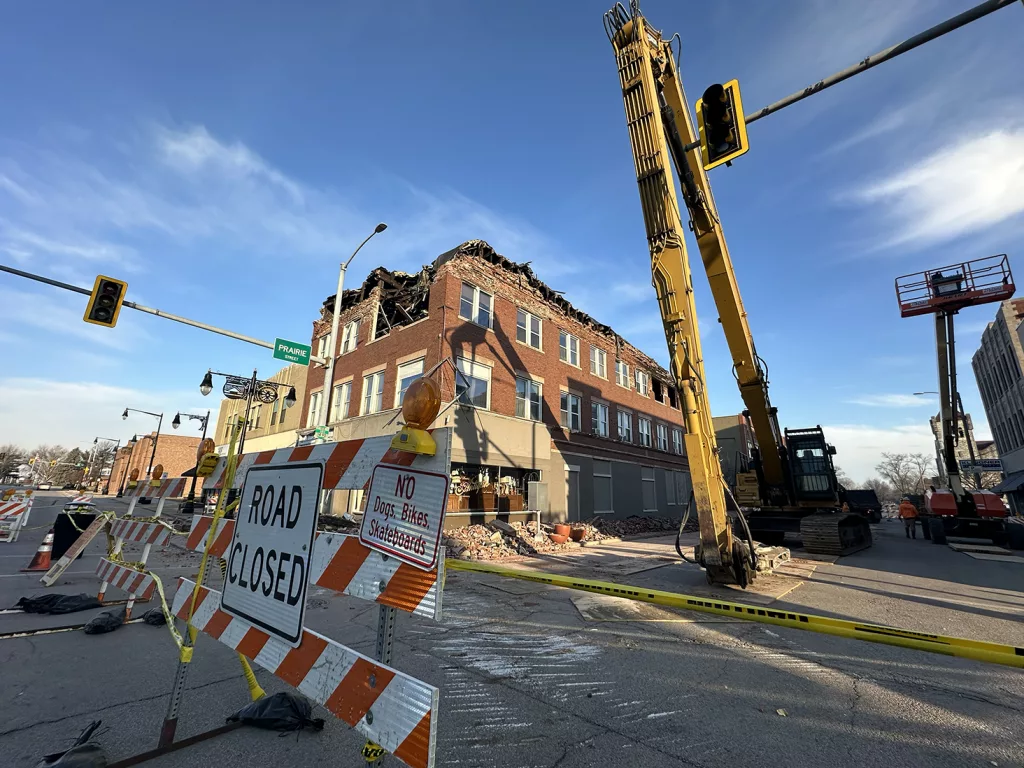 Demolition work continues Wednesday on a fire-damage building at 149-151 E. Main St.