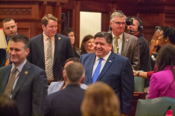 Gov. JB Pritzker enters the Illinois House Chamber on Wednesday, Feb. 21, to deliver his annual State of the State and budget address.