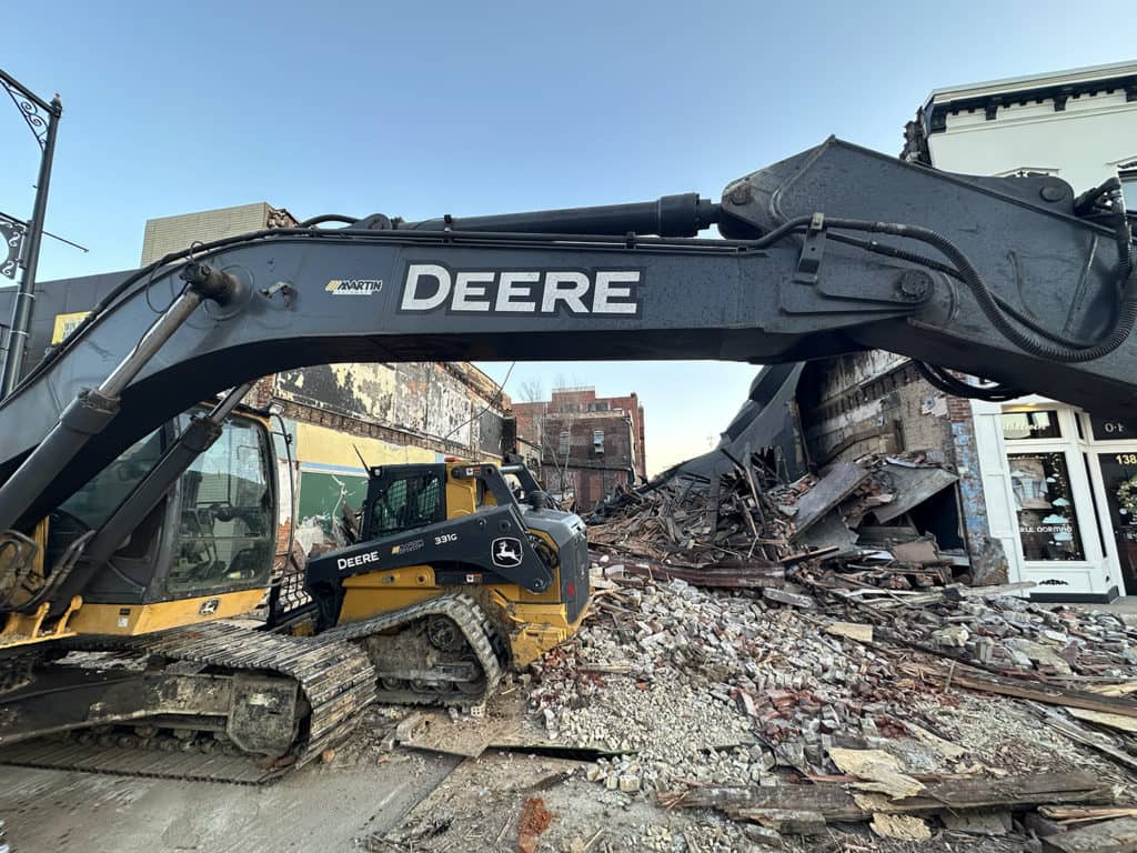 Demolition of the fire-damaged buildings 140-144 E. Main St. got underway Monday, March 18, 2024. 