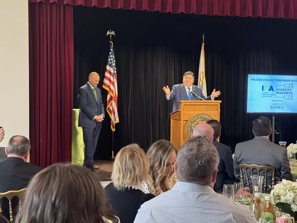 Gov. JB Pritzker congratulates the finalists for “the coolest thing made in Illinois” at the 5th annual “Makers Madness” contest ceremony at the Governor's Mansion on Wednesday. The contest is hosted by the Illinois Manufacturers’ Association. (Capitol News Illinois photo by Cole Longcor)