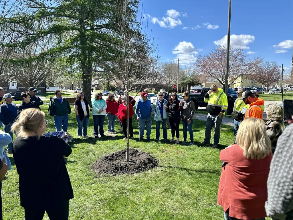 A small group of family, friends and co-workers gathered in Standish Park on blustery Friday, April 12, 2024, for a tree-planting ceremony in honor of former Galesburg city arborist Gary "Pee Wee" Johnson.