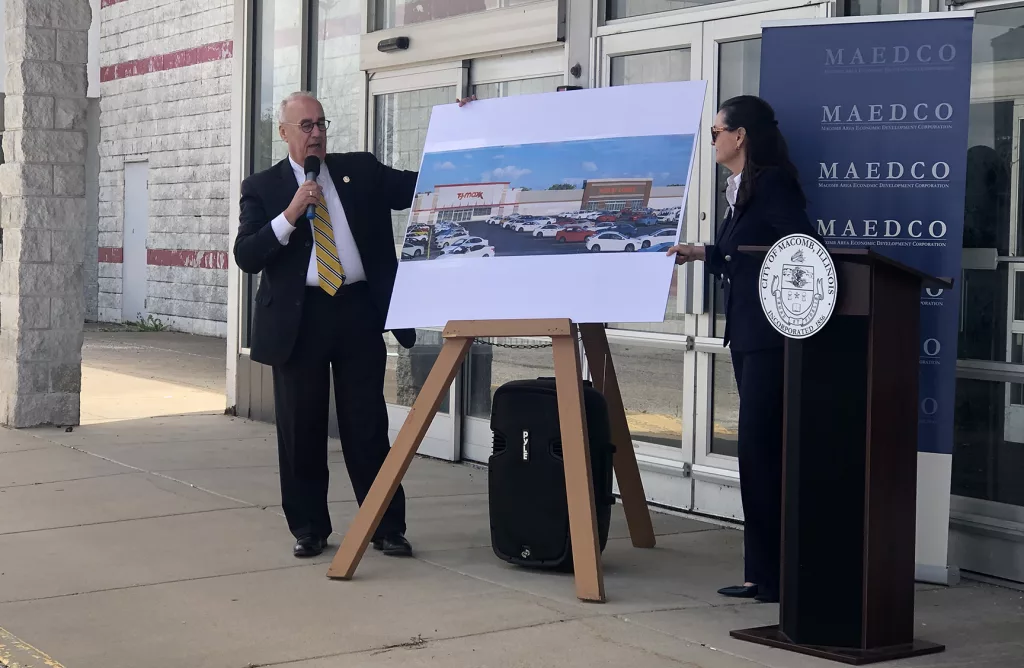 Macomb Mayor Mike Inman and Kim Pierce, executive Director of the Macomb Area Economic Development Corporation, unveil two new retailers that will open in the former Kmart in Macomb.