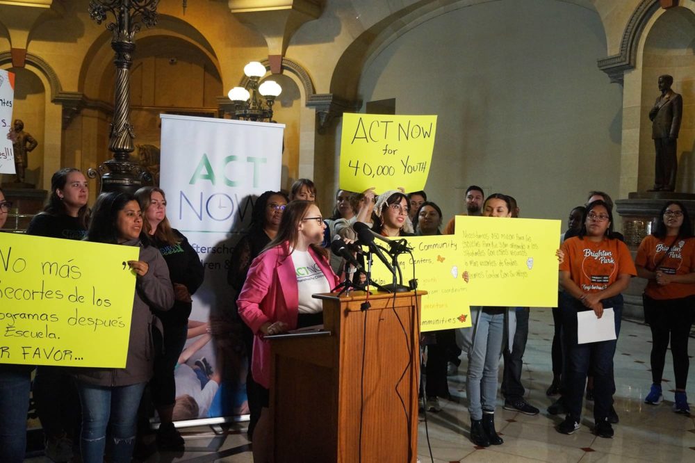 Susan Stanton, executive director of the advocacy group ACT Now, leads a rally calling on state lawmakers to provide funding to prevent after-school programs that serve an estimated 40,000 students statewide from being forced to close this summer. (Capitol News Illinois photo by Peter Hancock)
