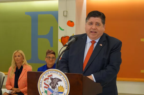 Gov. JB Pritzker announces the launch of a new summer nutrition program for school-age children during a news conference at Enos Elementary in Springfield. (Capitol News Illinois photo by Peter Hancock)