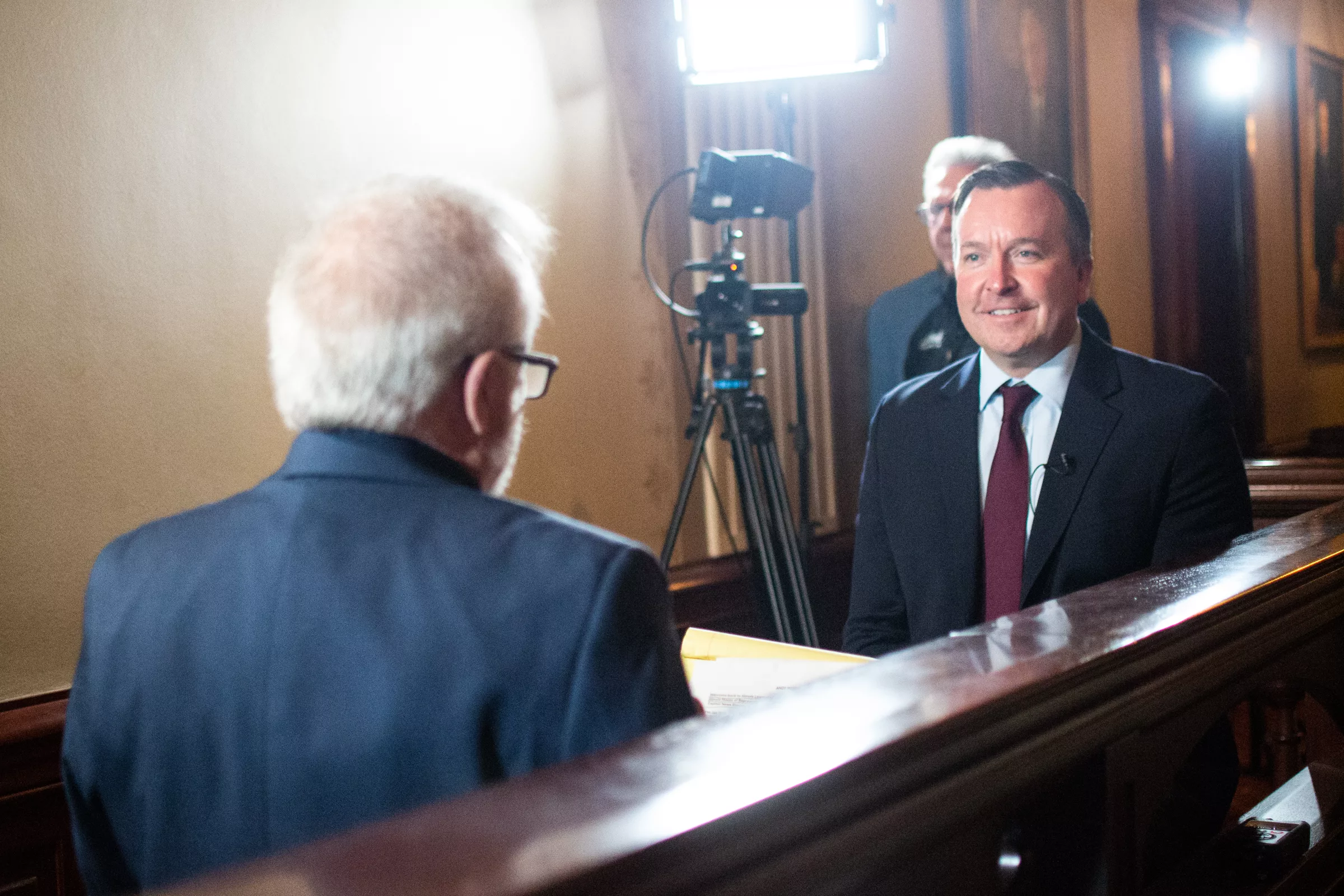 Deputy Gov. Andy Manar talks to host Jak Tichenor on the set of “Illinois Lawmakers,” Illinois’ longest-running state government-focused TV program that is now a production of Capitol News Illinois. Manar told Tichenor none of the governor’s revenue proposals – or any brought forth by the General Assembly – are off the table with a week remaining in the legislative session. (Capitol News Illinois photo by Jerry Nowicki)