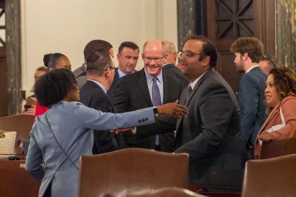 Lawmakers in the Illinois Senate celebrate Sunday night after passing a budget. (Capitol News Illinois photo by Jerry Nowicki)