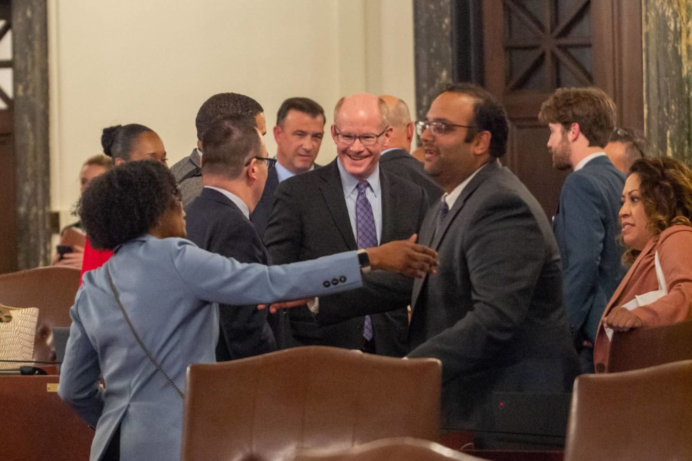 Lawmakers in the Illinois Senate celebrate Sunday night after passing a budget. (Capitol News Illinois photo by Jerry Nowicki)