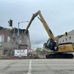 Fire-demo-060124-2: A crew from River City Demolition of Peoria started the demolition process at 149-151 E. Main Street at 8:45 a.m. Saturday, June 1, 2024. (JAY REDFERN/WGIL)