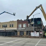 Fire-demo-060124-1: A crew from USA Recycling started the demolition process at 149-151 E. Main Street at 8:45 a.m. Saturday, June 1, 2024. (JAY REDFERN/WGIL)