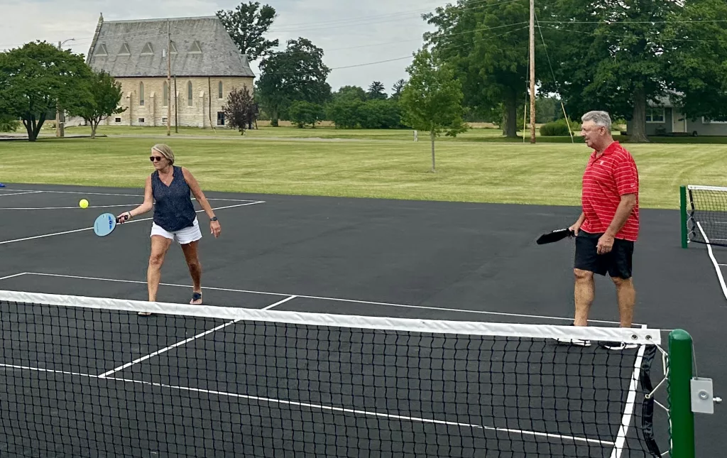 Lisa Lucchini and Brad Lucchini, avid Pickleball players visiting from Florida, play at the new courts in Knoxville.