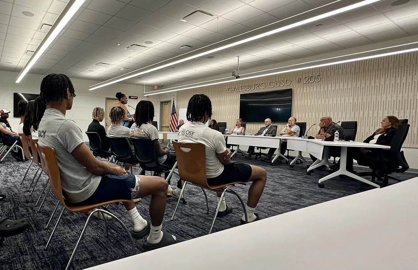 With past and current players in attendance, member of the public address the District 205 Board of Education on the future employment of Head Football Coach Derrek Blackwell during a special meeting Wednesday night.