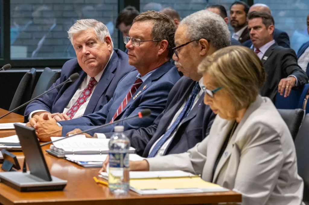 During a Senate Transportation Committee hearing Tuesday, Regional Transportation Authority Board Chair Kirk Dillard looks at the heads of Chicagoland's transit agencies: Metra CEO James Derwinski, Chicago Transit Authority President Dorval Carter and Pace Executive Director Melinda Metzger. (Capitol News Illinois photo by Andrew Adams)