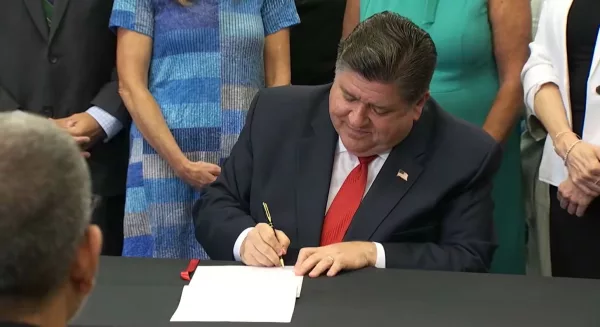 Gov. JB Pritzker signs a bill to pause then further regulate carbon capture technology in Illinois. (Credit: Illinois.gov)