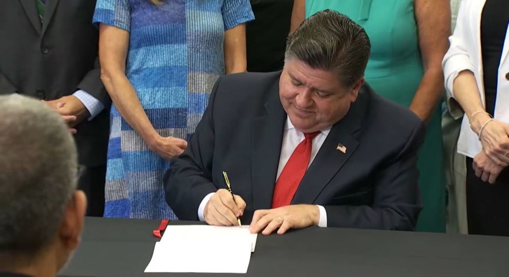 Gov. JB Pritzker signs a bill to pause then further regulate carbon capture technology in Illinois. (Credit: Illinois.gov)