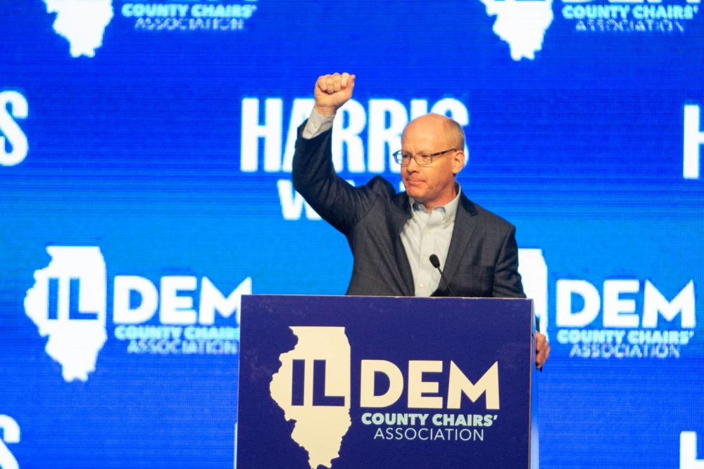 Senate President Don Harmon waves to the crowd at the Illinois Democratic County Chairs’ Association brunch. He encouraged Illinois Democrats to “embrace the boring” of governance. (Capitol News Illinois photo by Jerry Nowicki)
