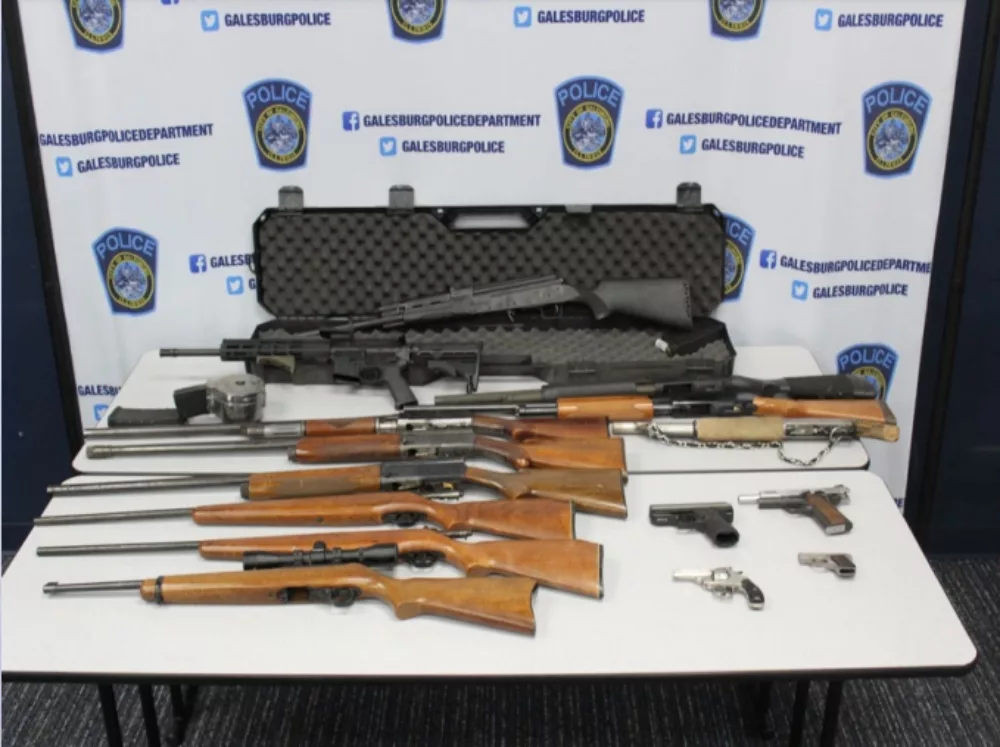 Galesburg Police display the guns they claim were taken from the home of Leslie Mixon, 60, during an investigation August 16. (Galesburg Police Photo)