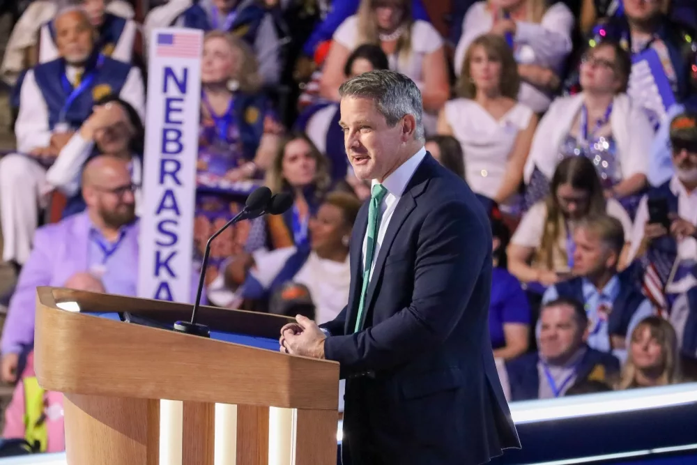 Former U.S. Rep Adam Kinzinger addresses the Democratic National Convention. The vocal critic of Donald Trump has been a leading member of “Republicans for Harris.” (Capitol News Illinois photo by Andrew Adams)