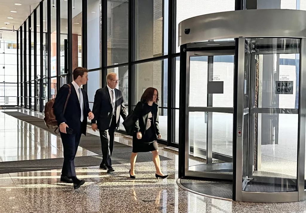 Retired AT&T Illinois lobbyist Steve Selcke leaves the Dirksen Federal Courthouse on Thursday with his attorneys after testifying in the bribery case of his former boss Paul La Schiazza. (Capitol News Illinois photo by Hannah Meisel)