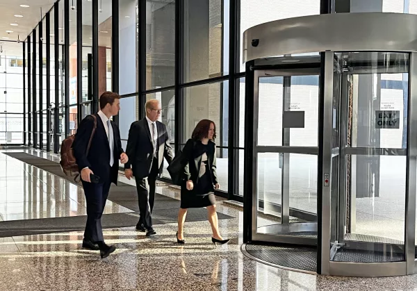 Retired AT&T Illinois lobbyist Steve Selcke leaves the Dirksen Federal Courthouse on Thursday with his attorneys after testifying in the bribery case of his former boss Paul La Schiazza. (Capitol News Illinois photo by Hannah Meisel)