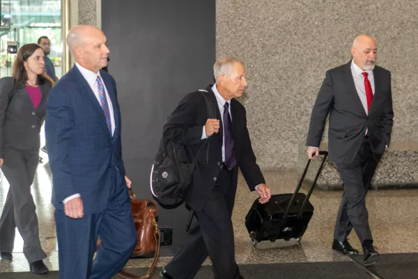 Flanked by his legal team, former AT&T executive Paul La Schiazza exits the Dirksen Federal Courthouse in downtown Chicago on Sept. 10. La Schiazza is accused of bribing former Illinois House Speaker Michael Madigan. (Capitol News Illinois photo by Andrew Adams)