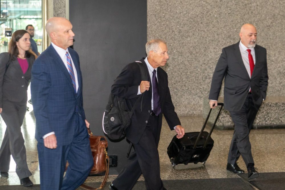 Flanked by his legal team, former AT&T executive Paul La Schiazza exits the Dirksen Federal Courthouse in downtown Chicago on Sept. 10. La Schiazza is accused of bribing former Illinois House Speaker Michael Madigan. (Capitol News Illinois photo by Andrew Adams)