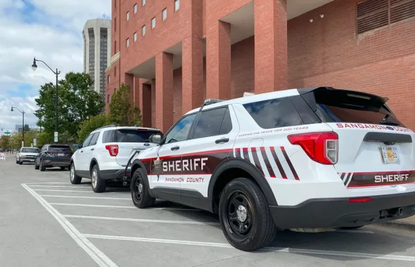 A Sangamon County Sheriff’s Office car is pictured outside of the county building in Springfield. (Capitol News Illinois photo by Jerry Nowicki)