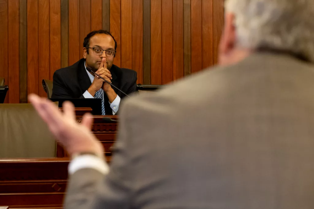 Senate Transportation Committee Chair Sen. Ram Villivalam, D-Chicago, listens to Illinois AFL-CIO President Tim Drea at a committee hearing. (Capitol News Illinois photo by Andrew Adams)